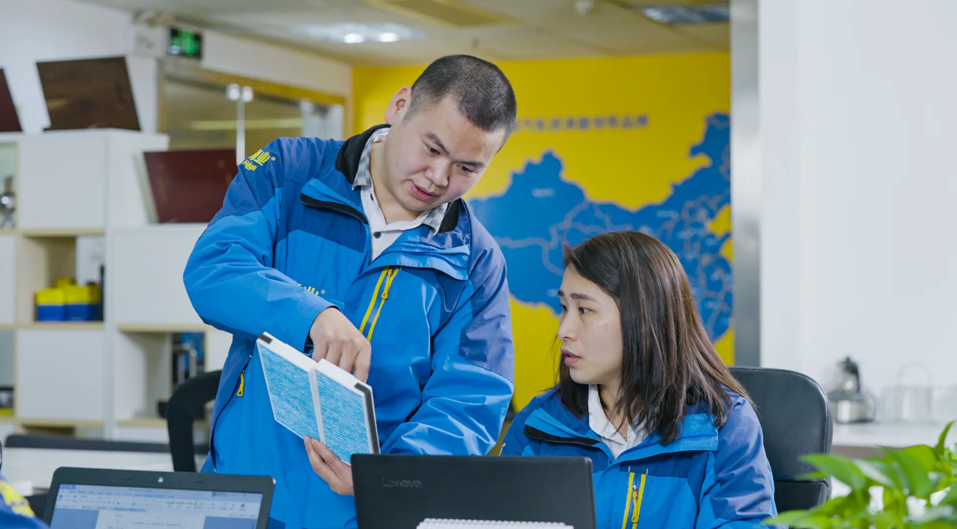 colleagues reviewing blue filter